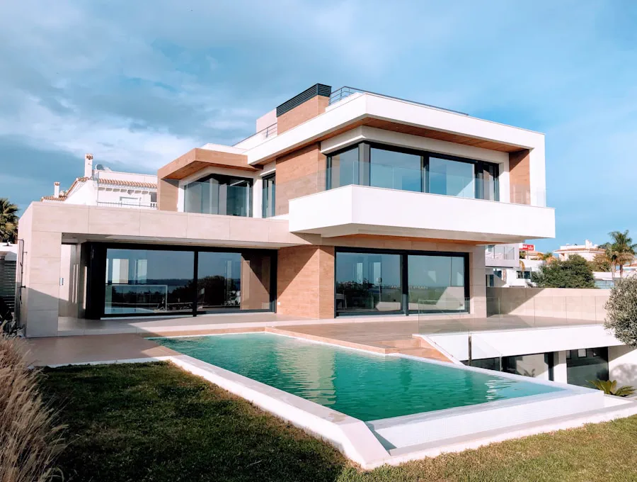 Terracotta villa with a lap pool and deep shade overhangs