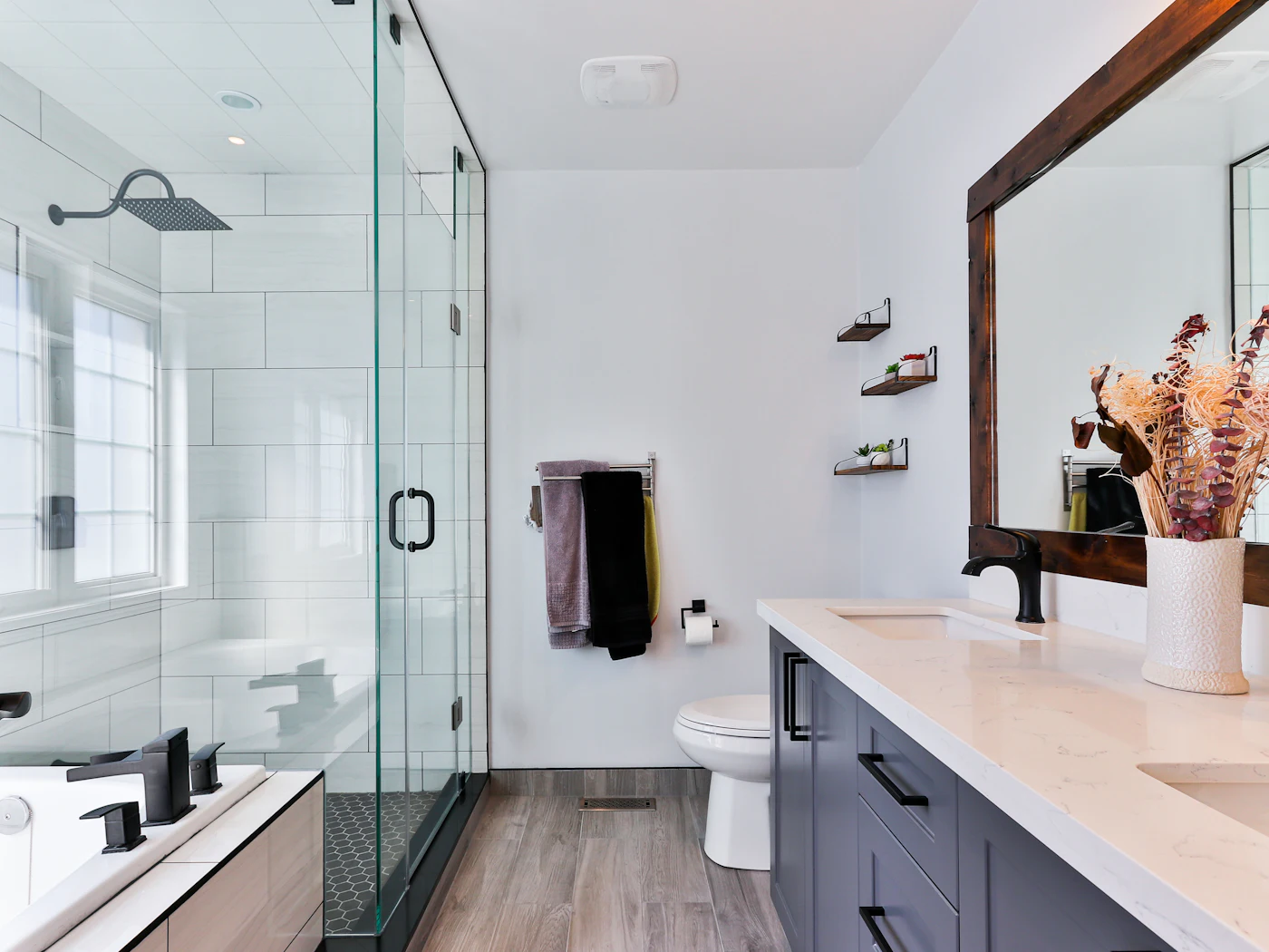 Bathroom with a walk-in glass shower and a double vanity