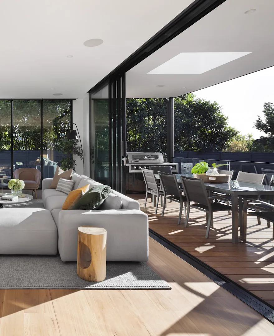 Dining space opening onto a glass wall